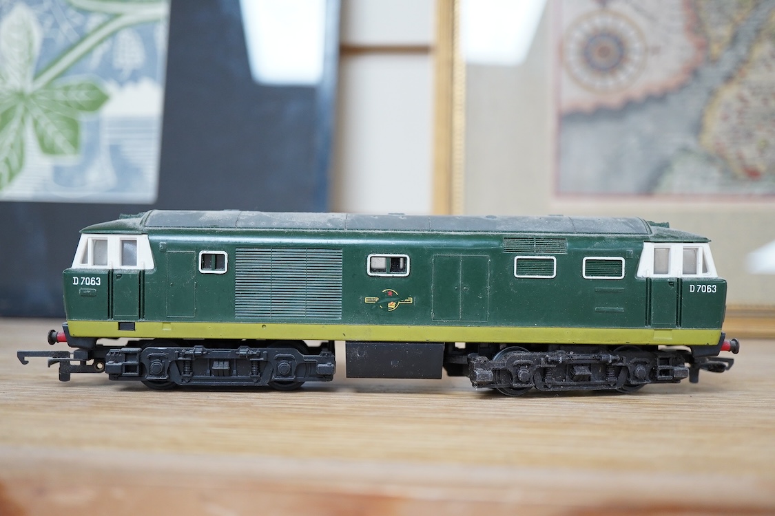 A quantity of 00 gauge railway by various makes, comprising; nine locomotives by Tri-ang, Hornby Dublo, etc. (one missing tender), sixteen maroon bogie coaches and eighteen freight wagons